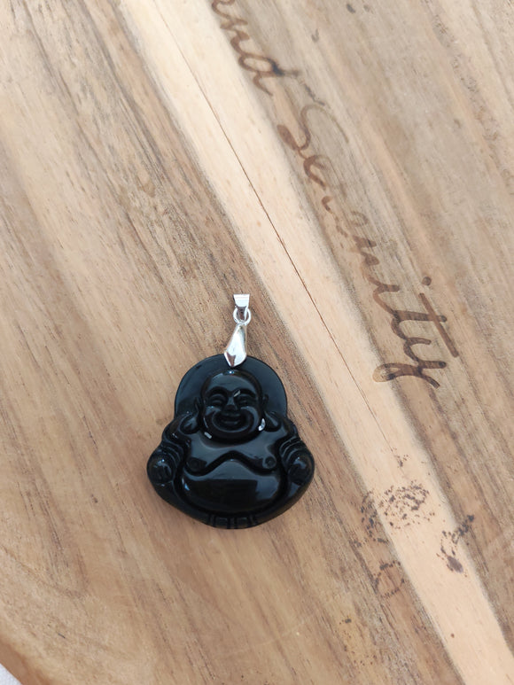 Pendentif bouddha obsidienne noire - posé sur bois